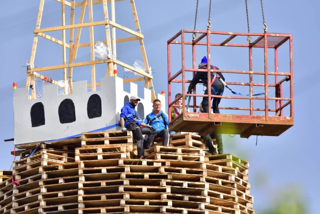 World's tallest bonfire towers at 200 feet ahead of being set alight this weekend, built entirely by hand from over 20,000 wooden pallets in Belfast.