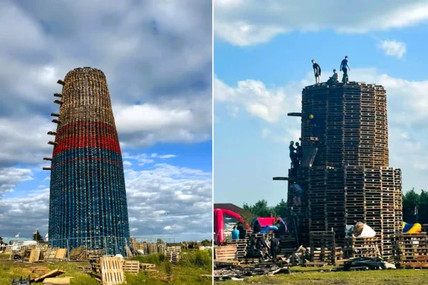 World's tallest bonfire towers at 200 feet ahead of being set alight this weekend, built entirely by hand from over 20,000 wooden pallets in Belfast.