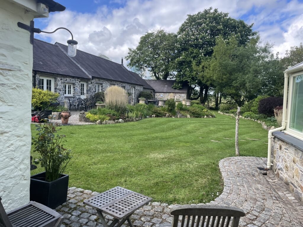 A woman turned an old milking parlour in her garden into a holiday let to top up her pension - then the council slapped her with a £9,000 tax bill.