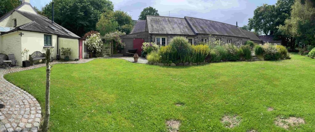 A woman turned an old milking parlour in her garden into a holiday let to top up her pension - then the council slapped her with a £9,000 tax bill.