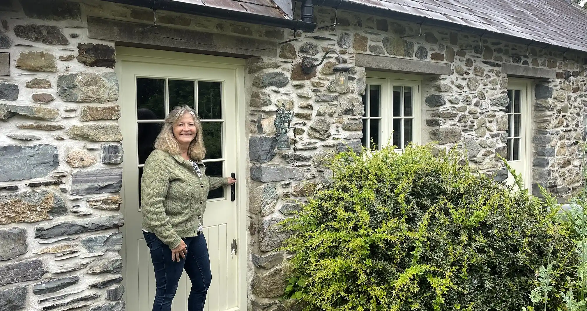 A woman turned an old milking parlour in her garden into a holiday let to top up her pension - then the council slapped her with a £9,000 tax bill.