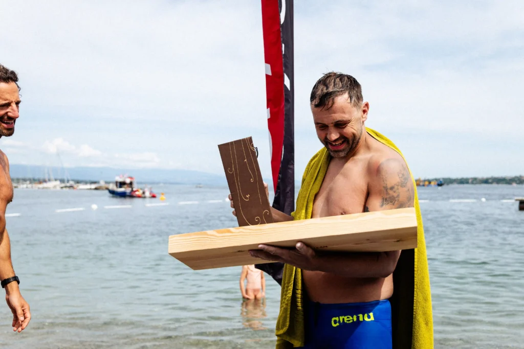 British dad becomes the first to swim Switzerland's 10 biggest lakes - 233 miles of freezing water for the charity that helped his son.
