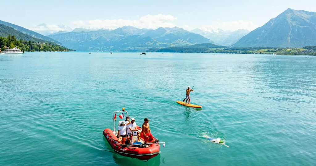 British dad becomes the first to swim Switzerland's 10 biggest lakes - 233 miles of freezing water for the charity that helped his son.