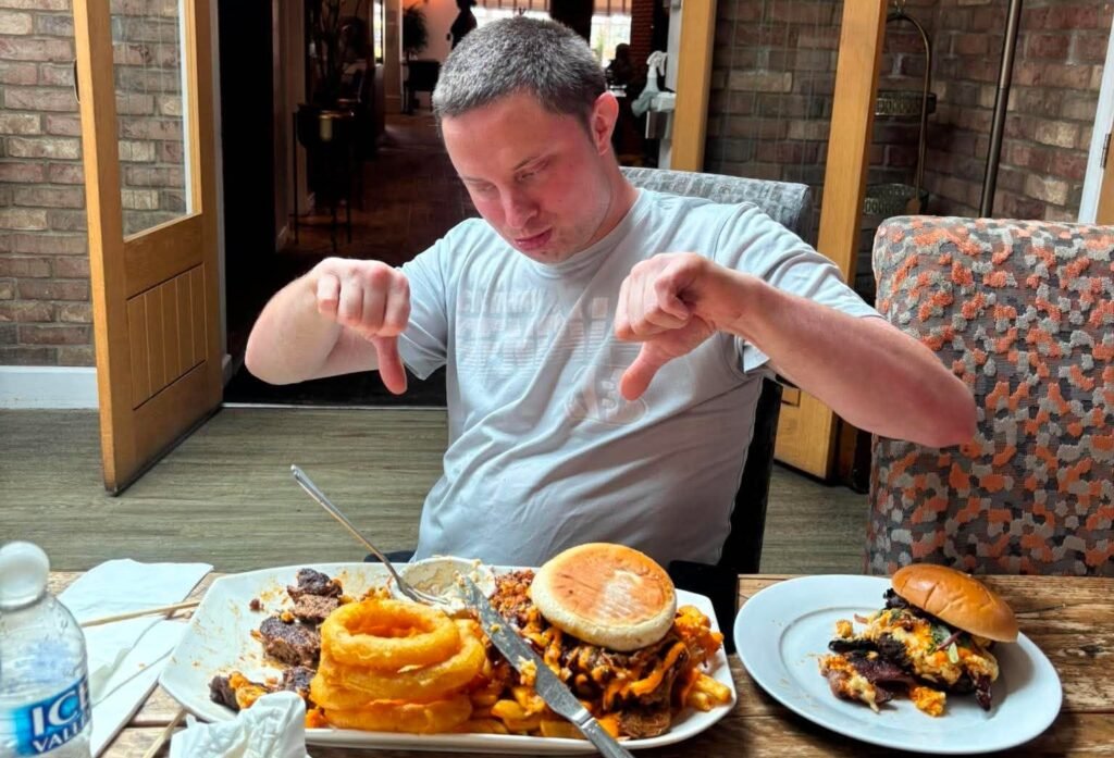 Brits have been beaten by one of the UK's biggest gut-busting burgers - a 5,000-calorie tower of beef, chicken, cheese, bacon and onion rings with a £100 prize.