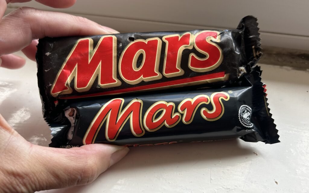 A cleaner clearing a hoarder's home was stunned by a 1991 Mars bar dwarfing today's version - a striking illustration of shrinkflation that has racked up 700,000 views.