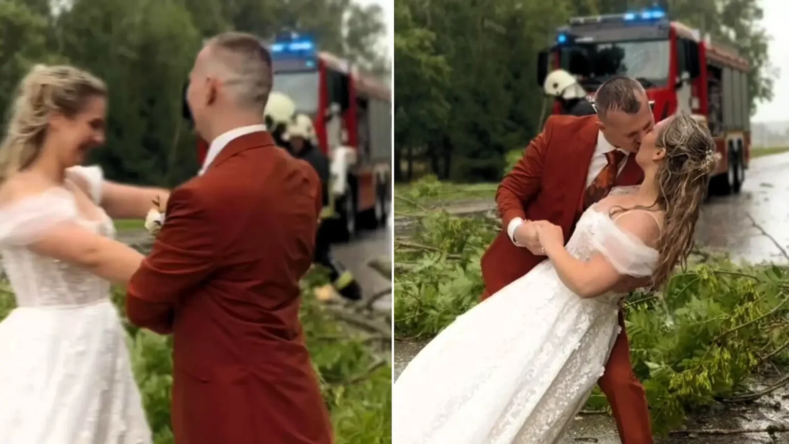Bride and groom carry on with their wedding photos in a storm - dancing in the rain as firefighters clear a fallen tree from the road behind them.