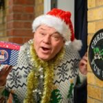 Man who has celebrated Christmas every day for 33 years says the heatwave made it 'unbearable' - so he now opens presents in a paddling pool.