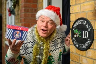 Man who has celebrated Christmas every day for 33 years says the heatwave made it 'unbearable' - so he now opens presents in a paddling pool.