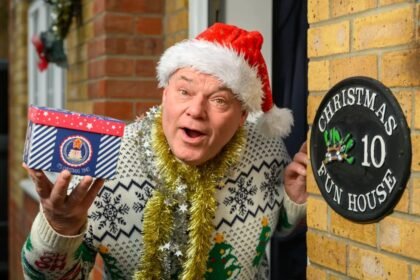 Man who has celebrated Christmas every day for 33 years says the heatwave made it 'unbearable' - so he now opens presents in a paddling pool.