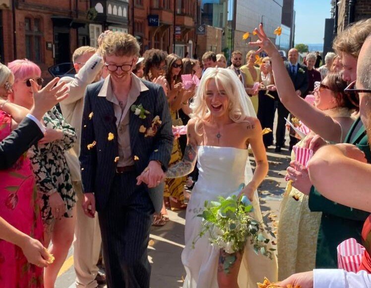 Bride who bought her dream wedding dress for just £2 at a charity shop pop-up is urging others to ditch designer gowns - after having it altered into a one-of-a-kind design.