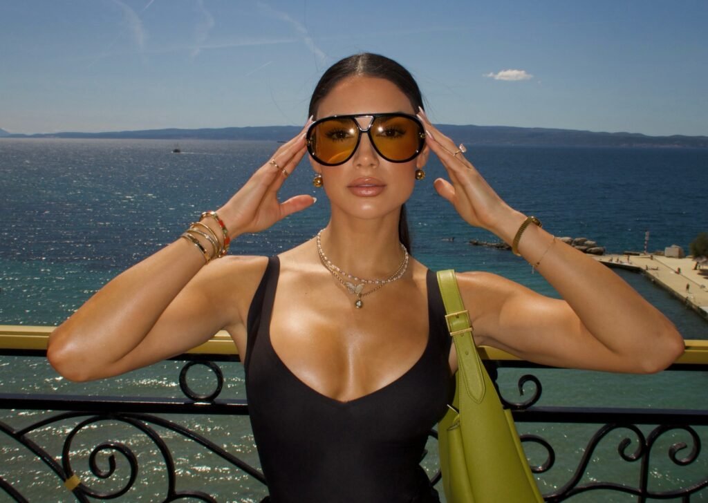 Beauty influencer is slammed as tacky and inconsiderate after filming herself doing an elaborate skincare routine - including a full sheet mask - during the three-hour movie The Odyssey.