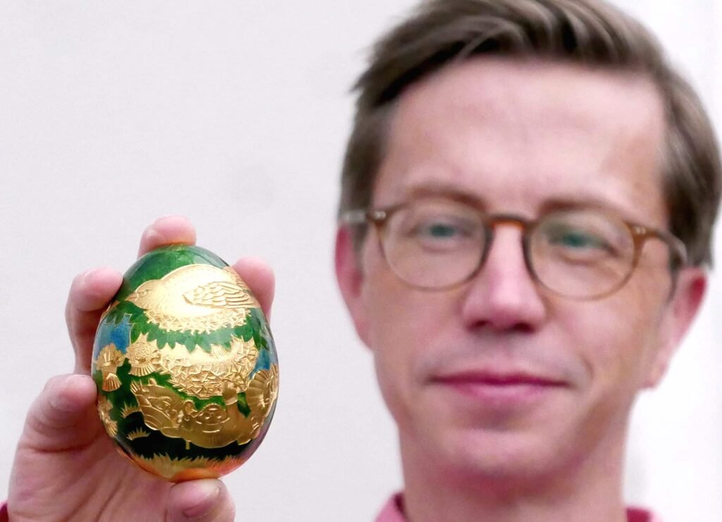A rare solid gold Cadbury egg from the 1983 Conundrum treasure hunt has sold for a staggering £123,500 - smashing a world auction record and its estimate six times over.