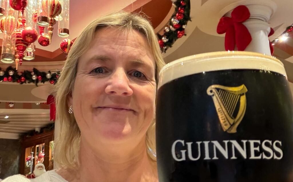 A woman inspired to make the most of life after losing her father before his retirement has visited 57 cities before her 50th birthday - on trips costing under £120.