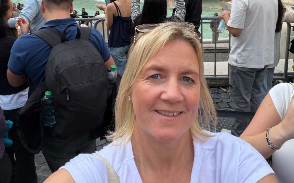 A woman inspired to make the most of life after losing her father before his retirement has visited 57 cities before her 50th birthday - on trips costing under £120.