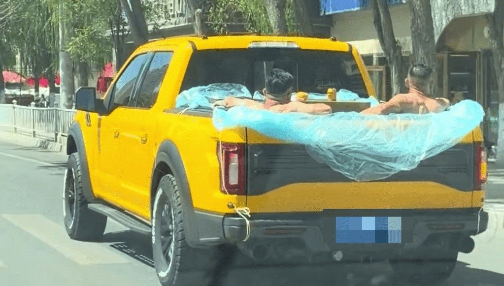 Three lads landed themselves in hot water after using their pickup truck as a mobile swimming pool, filmed sipping drinks and eating watermelon in the cargo bed.