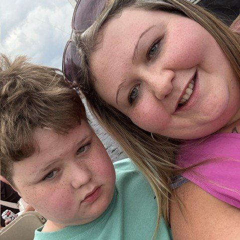 A devoted mum tattooed an entire keyboard on her arm so her non-speaking son can always talk to her - and his first typed words left her in tears.