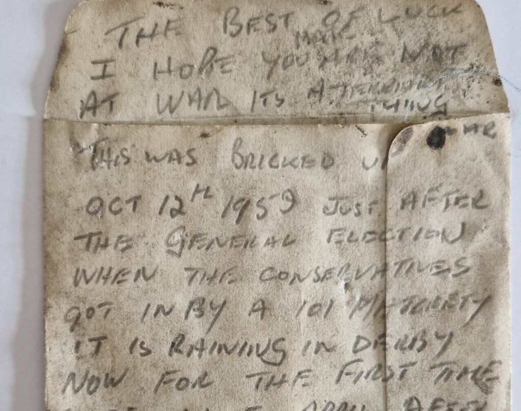 A workman's message in a whisky bottle, bricked up behind a Derby staircase in 1959, has been found 67 years on - a poignant note to whoever would one day uncover it.