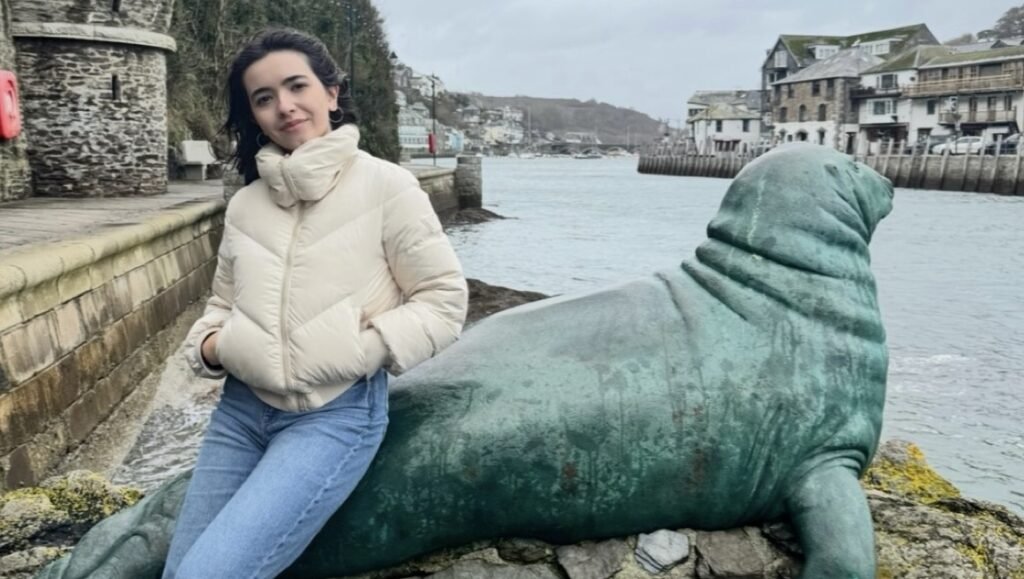 A student was left stunned after stumbling across around 40 playful seals gathered together inside a hidden cave in Cornwall - calling it a moment she'll never forget.