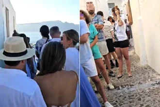 The grim reality of Santorini has been exposed as thousands of holidaymakers were spotted queueing at 6.30am for the same Instagram snap in front of the island's iconic blue dome.