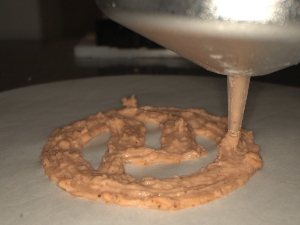 Scientists have turned a discarded plastic bottle into an edible vanilla cookie in a bizarre experiment that could one day help tackle food shortages.