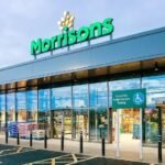 Morrisons is rolling out AI-powered self-checkouts across 200 stores, using real-time computer vision to spot missed items and prompt shoppers to self-correct.