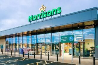 Morrisons is rolling out AI-powered self-checkouts across 200 stores, using real-time computer vision to spot missed items and prompt shoppers to self-correct.