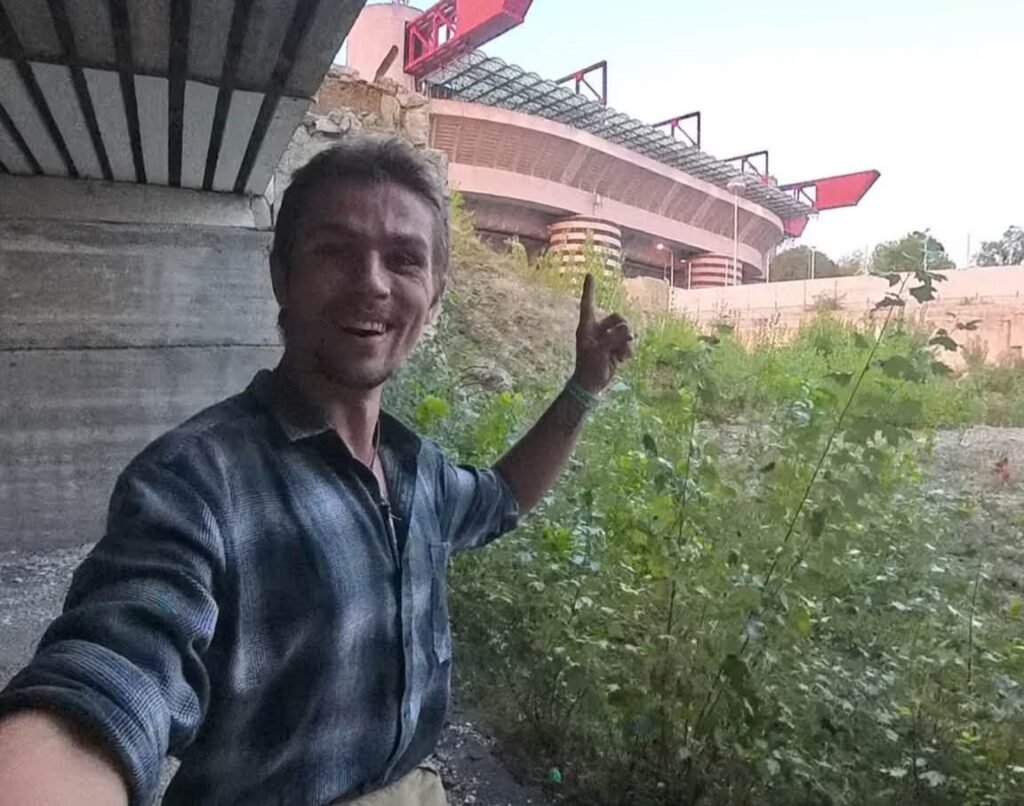 A British base jumper has landed himself in hot water after leaping off the San Siro at dawn - having spent the night hiding inside the empty football stadium.