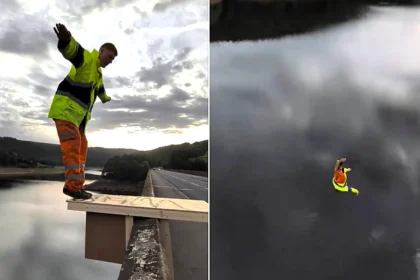 A Brit has performed a stunning Olympic-style twisting dive off a bridge in full hi-vis gear - using a makeshift diving board he built with his mates.