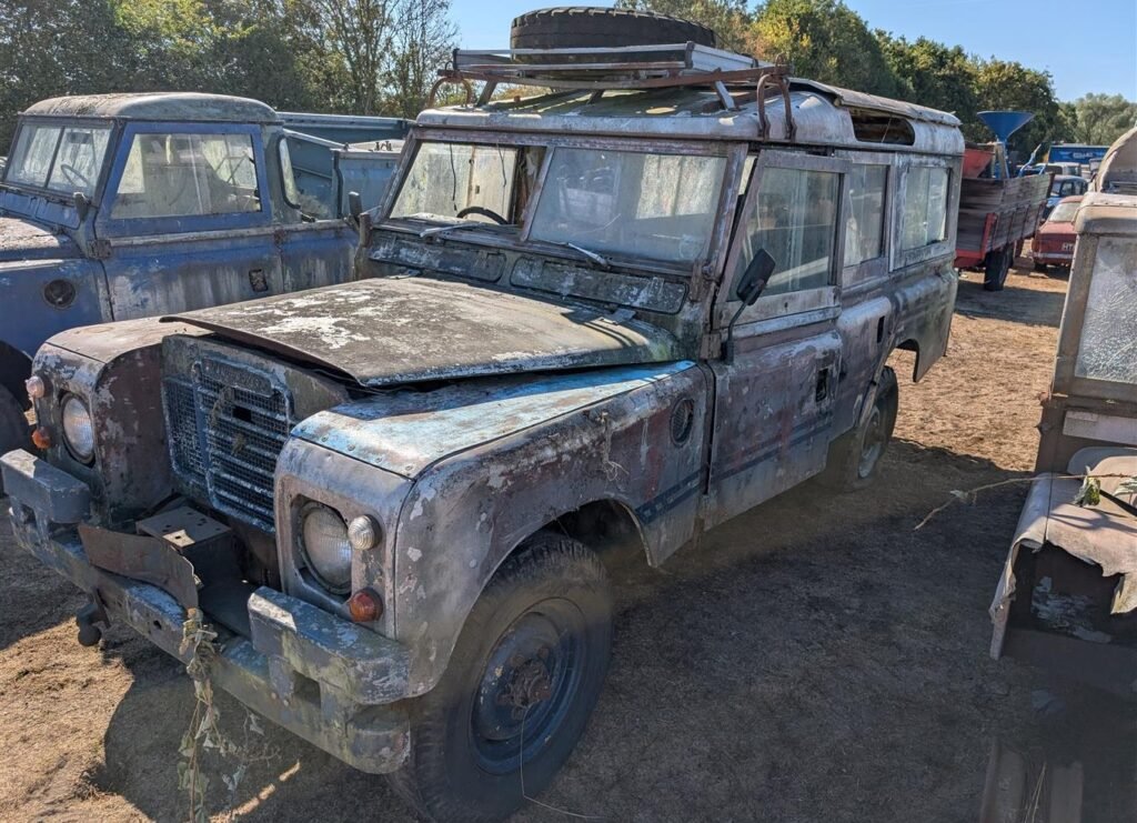 A hoard of more than 150 classic cars, tractors and boats unseen for decades has been found hidden across six Bedfordshire barns - and could fetch £250,000 at auction.