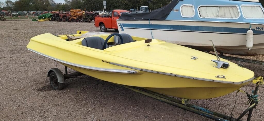 A hoard of more than 150 classic cars, tractors and boats unseen for decades has been found hidden across six Bedfordshire barns - and could fetch £250,000 at auction.
