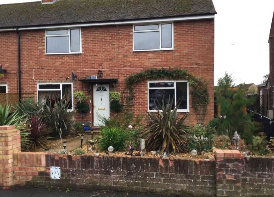 A couple have spent £25,000 turning their council house garden into a paradise with an aviary, spa, outdoor kitchen and gym - even the housing officer was stunned.
