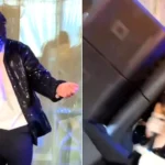 A Michael Jackson tribute act was nearly crushed by a falling speaker mid-Billie Jean at a wedding - with the moment caught in a window reflection.