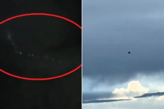 A giant 'UFO' has been filmed lurking behind a cloud over Taiwan - and viewers are convinced the glowing grid of lights is an alien mothership.