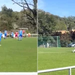 A bungling groundsman in Germany was filmed repainting the penalty box lines mid-match - only realising both teams had kicked off when play came hurtling towards him.
