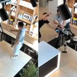 CCTV captured humanoid robot Syoma swinging its legs at a customer who shoved it in a Russian tech store - staff wrestled the machine back under control.