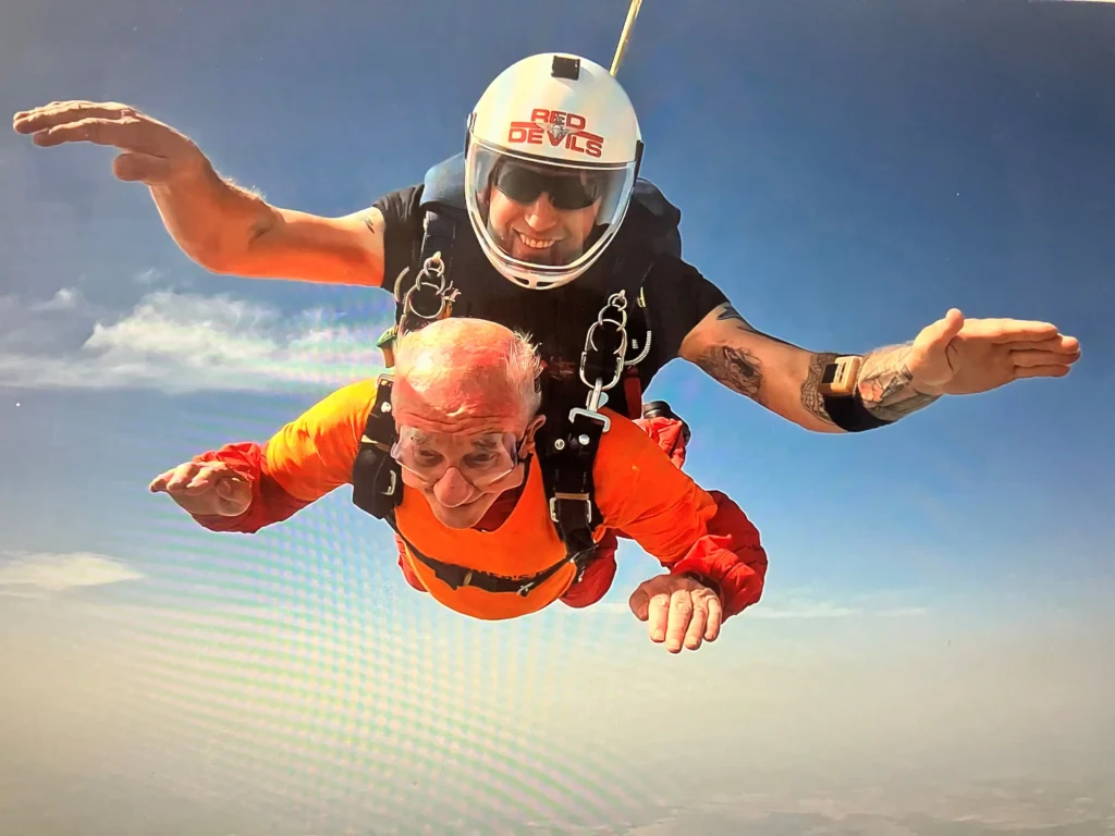 A 93-year-old has raised more than £35,000 by ziplining 300 metres across the seafront - all in honour of his wife of 68 years, who has Alzheimer's.