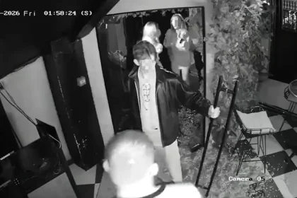 Watch the moment a man yanks open a bar door - only for the glass to explode into shards, leaving him frozen in the doorway still gripping the handle.