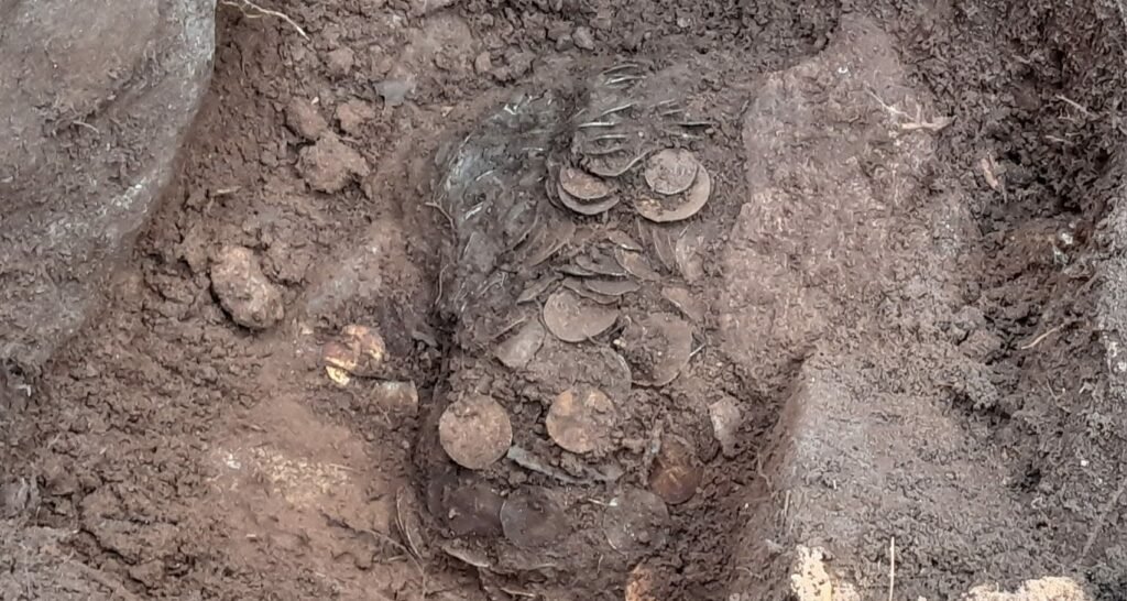 A treasure hunter who was about to give up has unearthed Finland's biggest ever Viking-era hoard - thousands of silver coins stashed in two birch-bark pots.