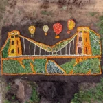 An iconic bridge built by Britain's most famous engineer has been recreated using thousands of pumpkins - all grown at a zoo using dung from its elephants.