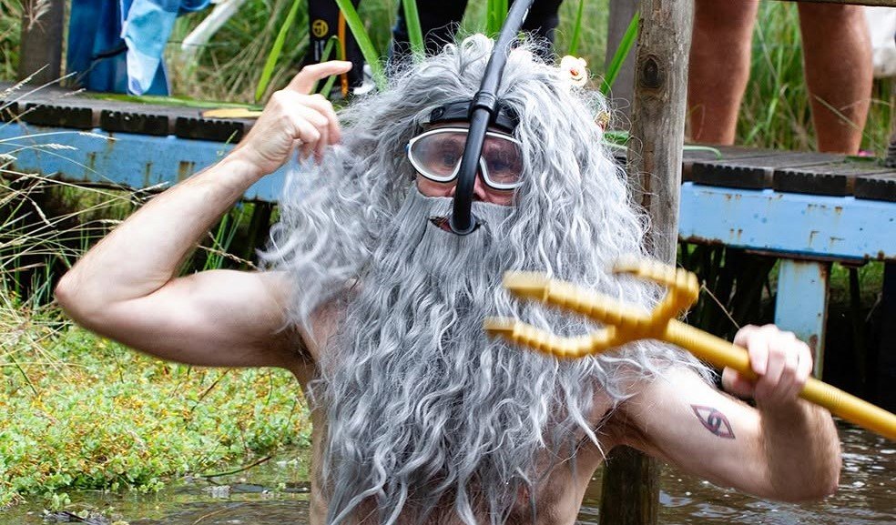 Daredevils dived headfirst into a filthy 120-yard bog as the World Bog Snorkelling Championships hit 40 years - with Emily Hall crowned champ in just 1:27.97.