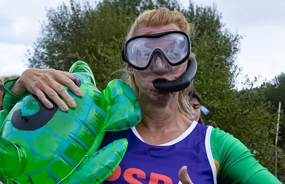 Daredevils dived headfirst into a filthy 120-yard bog as the World Bog Snorkelling Championships hit 40 years - with Emily Hall crowned champ in just 1:27.97.