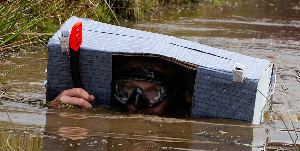 Daredevils dived headfirst into a filthy 120-yard bog as the World Bog Snorkelling Championships hit 40 years - with Emily Hall crowned champ in just 1:27.97.