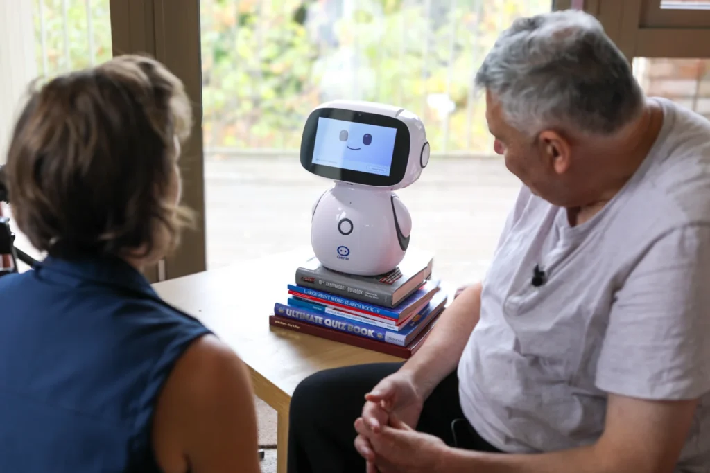 British pensioner, 74, gets robot companion named Robert to remind her to take medication and chat about washing. Meet Genie, the digital helper changing care homes.