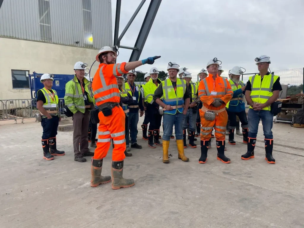 Britain's last deep tin mine prepares to reopen after 400 years as shanty singers perform 150ft underground in South Crofty, Cornwall, testing eerie acoustics.