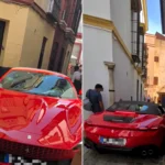 A Ferrari driver got his luxury supercar stuck in Seville's narrow old town streets, forcing locals to gather and watch the bungling rescue attempt unfold.