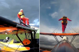99-year-old Helga Duffy becomes world's oldest wing walker after strapping herself to plane. Inspired by another pensioner, she raised over £1,300 for charity.