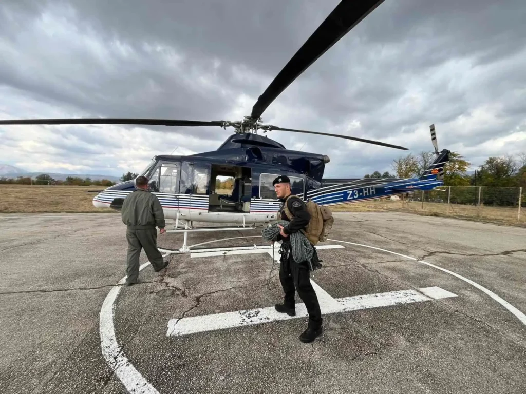 Bart Pitala boarding helicopter for rapid deployment to expedition.
