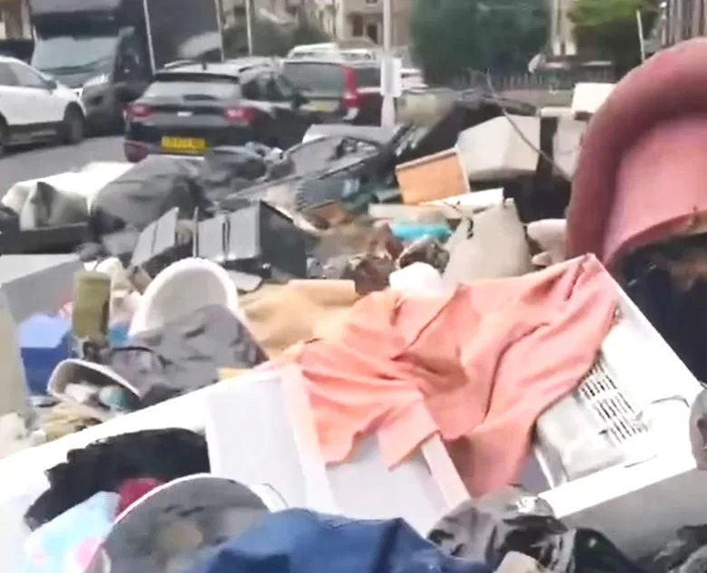 Brit residents have been left fuming as an ‘eyesore’ mountain of rubbish has been dumped on their street. Mattresses, sofas and household appliances were left strewn.