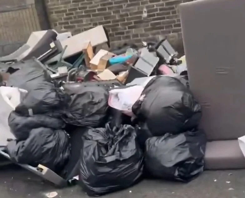 Brit residents have been left fuming as an ‘eyesore’ mountain of rubbish has been dumped on their street. Mattresses, sofas and household appliances were left strewn.