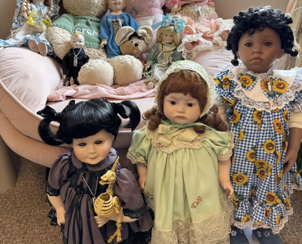 A woman who lives with dozens of ‘haunted’ dolls says Halloween is the craziest time of year in her house, with mischievous activity ramping up.